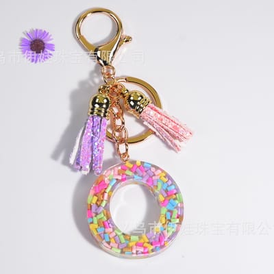 Sleutelhangers of voor je tas van A tot Z - met een pompon of kwastje - met letter - mooi design - handgemaakt - sleutelhangers - design - mode - goud - zwart - blauw - roze- rood