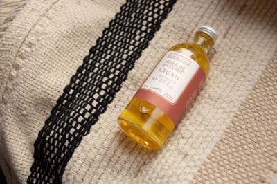 Biologische Massageolie met puur en eerlijke Arganolie - amber en sinasappel geur 100ml