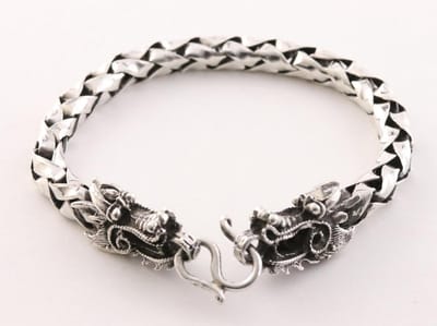 Zware zilveren armband met drakenkoppen en schubbenschakels - polsomtrek 16 cm
