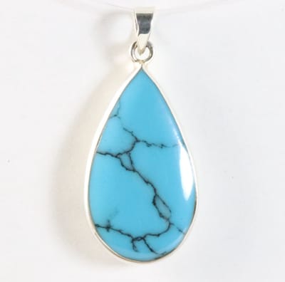 Druppelvormige zilveren hanger met blauwe turkoois
