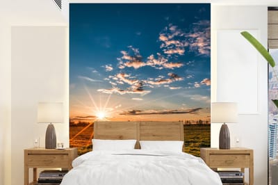 Behang - Fotobehang Zonsondergang - Natuur - Wolken - Gras - Breedte 195 cm x hoogte 260 cm