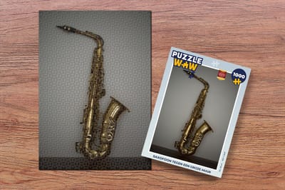 Puzzel Saxofoon tegen een grijze muur - Legpuzzel - Puzzel 1000 stukjes volwassenen