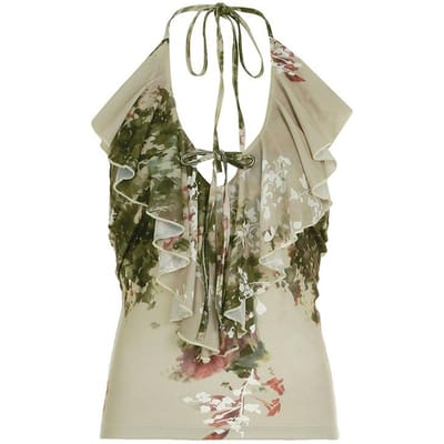 Kleine vest met plantenprint om de nek te hangen, ruchebladrand met vetersluiting en contrasterende rugloze Spice Girl-top. L