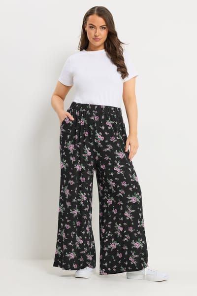 Yours Zwarte Jersey Broek Met Bloemenprint En Wijde Pijpen Size Regular > 42
