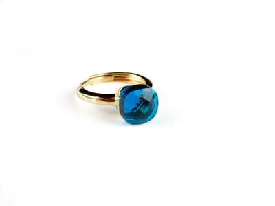 Ring in zilver geelgoud verguld model pomellato turkoois blauwe steen
