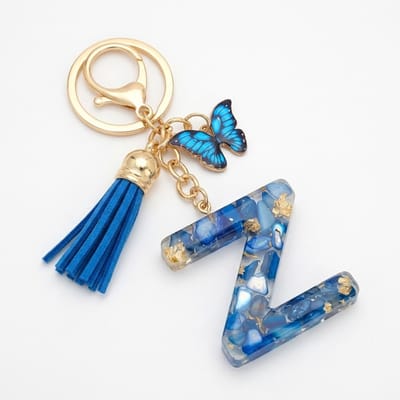 Blauwe letter Z sleutelhanger met kwastje en vlinder – sleutelhanger voor dames – goudkleurige metalen keychain met acryl initiaal Z hanger, decoratieve bedel en tassel