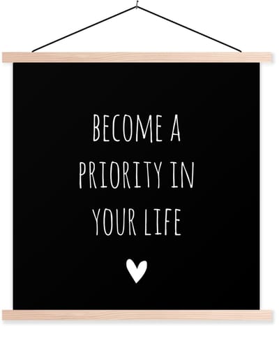 Posterhanger incl. Poster 60x60 cm - Schoolplaat - Engelse quote "Become a priority in your life" met een hartje tegen een zwarte achtergrond - Textielposter - Blanke latten