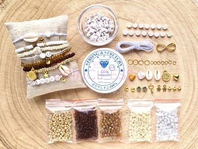 Zelf sieraden maken kralen pakket - Armbandjes - 4mm kraal met letterkralen, connector en gekleurd elastiek - Goud, oker, bruin, ivoor - DIY