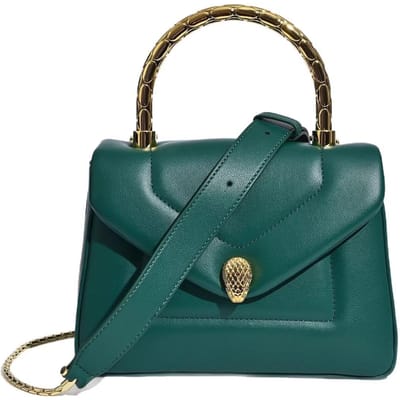 Dit is een modieuze en veelzijdige handtas met slangenkop, ook te dragen als crossbody tas 21*10*15cm groen
