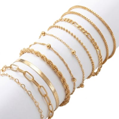 Set van 10 goudkleurige armbanden voor dames met diverse schakelpatronen – dames armbanden set met mix van glad, gedraaid en fijn design