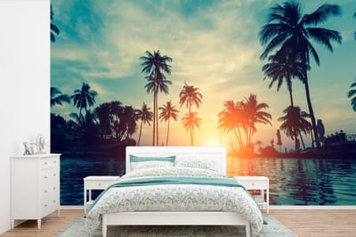 Behang - Fotobehang Zee - Zonsondergang - Palmboom - Wolken - Breedte 450 cm x hoogte 300 cm