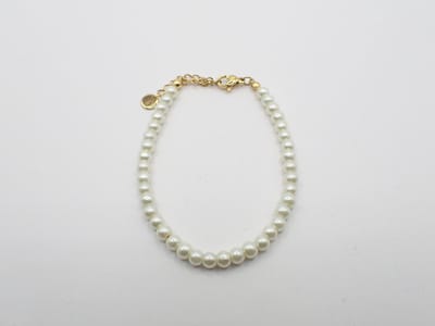 Colure® armband glasparels 6mm off-white goud