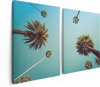 Artaza Canvas Schilderij Tweeluik Palmbomen met Bladeren in de Lucht - 120x80 - Foto Op Canvas - Canvas Print