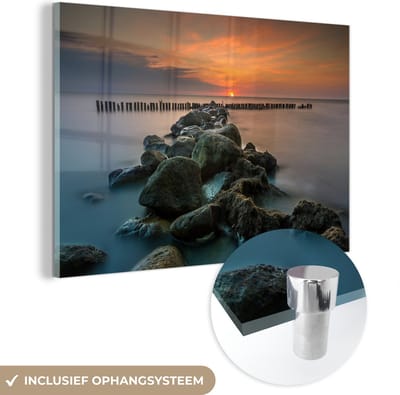 MuchoWow® Glasschilderij 150x100 cm - Schilderij acrylglas - Zee - Zon - Stenen - Foto op glas - Muurdecoratie woonkamer - Wanddecoratie slaapkamer - Schilderijen
