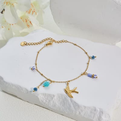 Armband zwaluw met blauwe kralen en bloem