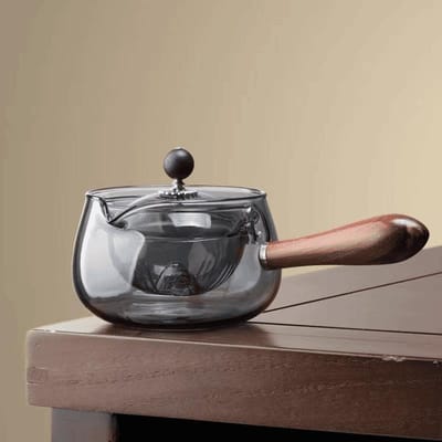 Théière Xiaoyao en verre borosilicate transparent de haute qualité, théière rotative couleur encre, idéale pour le salon avec table d'appoint pour les invités.