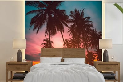 Behang - Fotobehang Zee - Palmboom - Zonsondergang - Strand - Silhouette - Breedte 240 cm x hoogte 240 cm