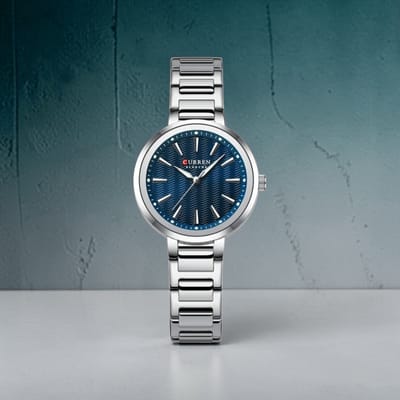 CURREN 9109 Dameshorloge Zilverkleurig Met Blauwe Wijzerplaat – Quartz Polshorloge met RVS Band, Lume Wijzers, Golfpatroon en 3ATM Waterbestendig – 5 Kleurvarianten – 32mm Dial