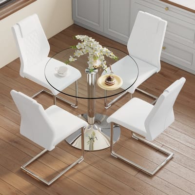 Eettafelset: Moderne, minimalistische eettafel van veiligheidsglas met een diameter van 85 cm, gecombineerd met 4 eetkamerstoelen met zilverkleurige metalen poten en witte PU-zittingen.