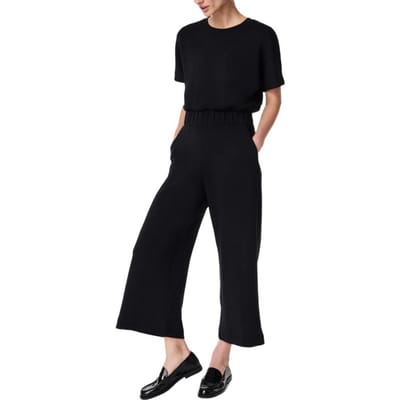 Combinaison d'été pour femme Col rond Manches courtes Taille élastique Jambes larges Poches latérales Couleur unie Surdimensionnée Décontractée Usage quotidien Cheville Pratique M noir