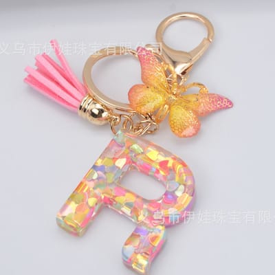 Sleutelhangers of voor je tas van A tot Z - met een pompon of kwastje - met letter - mooi design - handgemaakt - sleutelhangers - design - mode - goud - zwart - blauw - roze- rood