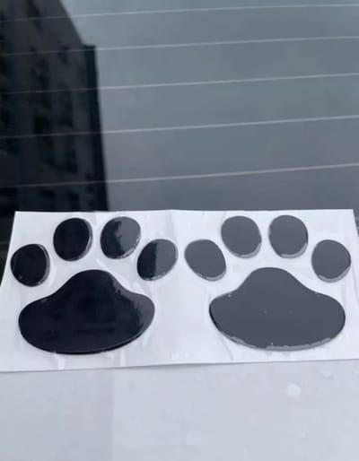GoedeDoelen.Shop | 3D sticker Hondenpootje / Kattenpootje zwart (2 stuks) | Autosticker | Scootersticker | Laptopsticker | Dierenwelzijn | Rescue Paws | Dierenleed