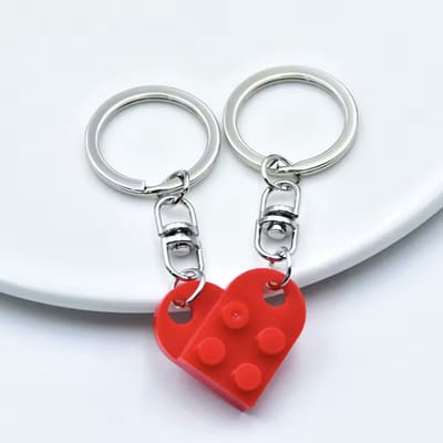 CHPN - Hartjes sleutelhanger - Vriendschaps sleutelhanger - Deelbare hartjes sleutelhanger - Perfect voor vriendschap en geliefden - Rood - Cadeau - Valentijn - Vriendschap - 2 delen