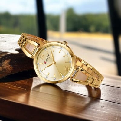 Luxe CURREN Dameshorloge Goudkleur met goudkleur wijzerplaat- Elegante Roestvrijstalen Horloge met Kristallen - Waterdicht & 5 Kleuren