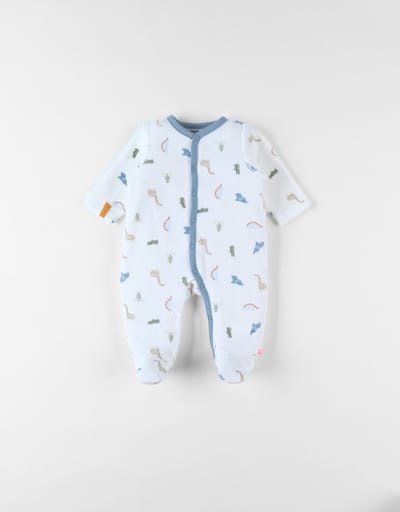 Noukie's Pyjama velours 1 delig ecru jurassic allover 0 maand 50