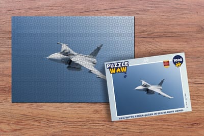 Puzzel Een witte straaljager in een blauwe hemel - Legpuzzel - Puzzel 1000 stukjes volwassenen