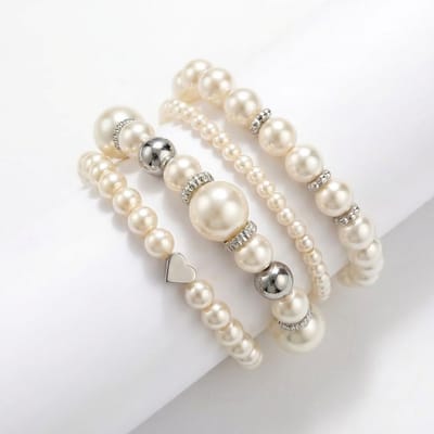 Set van 4 parelkleurige armbanden voor dames met zilverkleurige accenten – elastisch – hartdetail – ronde kralen – dames sieradenset