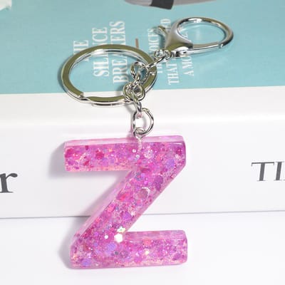 Sleutelhangers of voor je tas van A tot Z - met een pompon of kwastje - met letter - mooi design - handgemaakt - sleutelhangers - design - mode - goud - zwart - blauw - roze- rood