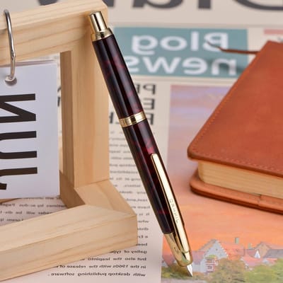Prachtige vulpen met fijne nib, terugtrekbaar met drukknop, inclusief inktconverter en metalen penbox, agaatrood