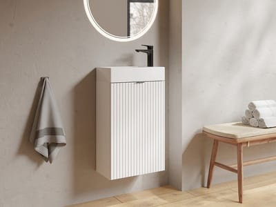 Vente-unique Geribbeld wastafelmeubel met omkeerbaar deurtje, wit - H60 x L40 x D22 - VAHIRA