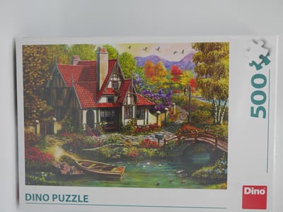 Dino Puzzel van een nostalgisch huis aan het water, 500 stukjes.