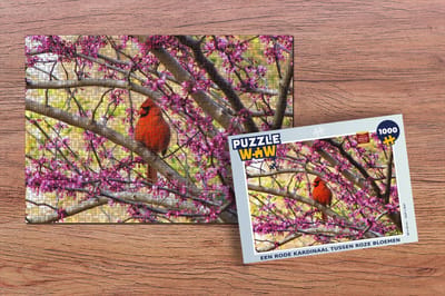 Puzzel Een rode kardinaal tussen roze bloemen - Legpuzzel - Puzzel 1000 stukjes volwassenen