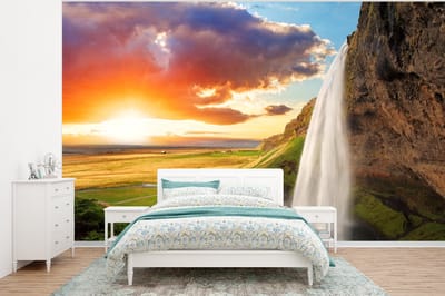 Behang - Fotobehang Waterval - Rots - Zonsondergang - Bergen - Oranje - Breedte 295 cm x hoogte 220 cm