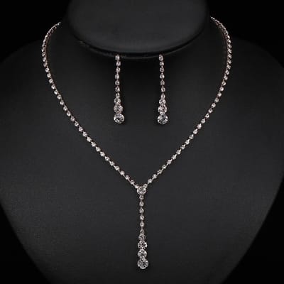 Ensemble de trois pièces de collier, boucles d'oreilles et bracelet en diamants pour mariée or