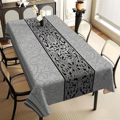 Fabriquée en polyester de première qualité, cette nappe présente un tissage jacquard fin, des broderies florales et des découpes ajourées.. Il est résistant à la chaleur et à la poussière. 100x145cm gray