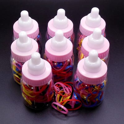 Babyflesjes transparant-roze-wit gevuld met gekleurde haarelastiekjes set van 8 stuks. #1