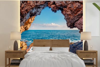 Behang - Fotobehang Grot - Zee - Rotsen - Natuur - Breedte 280 cm x hoogte 280 cm