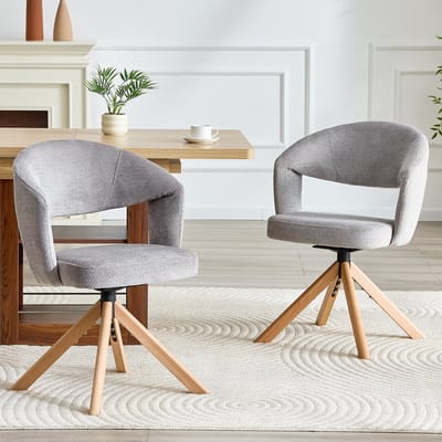 Set van 2 retro luxe draaistoelen. Grijze, gestructureerde stof met massief houten poten, totale hoogte 81,5 cm, 360° geruisloos draaibaar en gebogen rugleuning. Geschikt voor eetkamers en woonkamers.