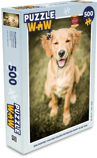 Puzzel Een portret van een Golden Retriever puppy in de tuin - Legpuzzel - Puzzel 500 stukjes