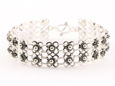 Fijn bewerkte zilveren schakelarmband - lengte 18 cm.