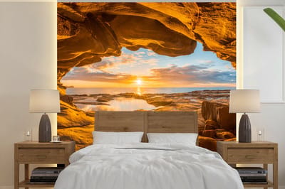 Behang - Fotobehang Grot - Zee - Horizon - Zonsondergang - Breedte 350 cm x hoogte 350 cm