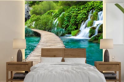 Behang - Fotobehang Brug - Water - Planten - Waterval - Groen - Breedte 220 cm x hoogte 220 cm
