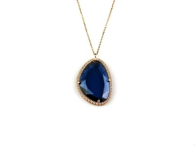 model Druppel gezet ketting in zilver roze verguld met hanger gezet met blauwe steen en cubic zirconia