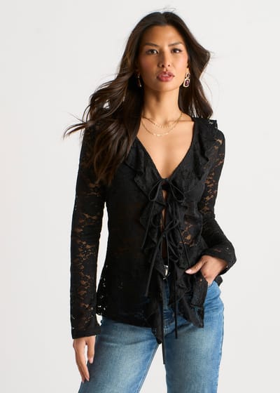 Zwarte jersey blouse met ruches en strik aan de voorkant