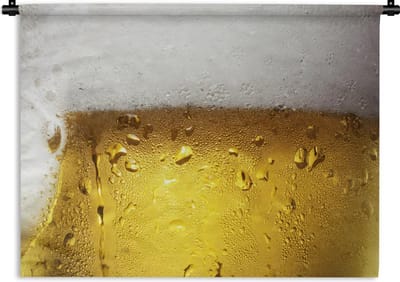 Wandkleed Bier - Overvol glas bier met condensatie Wandkleed katoen 60x45 cm - Wandtapijt met foto