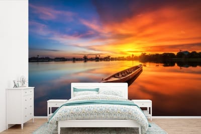 Behang - Fotobehang Boot - Water - Zonsondergang - Oranje - Water - Breedte 420 cm x hoogte 280 cm